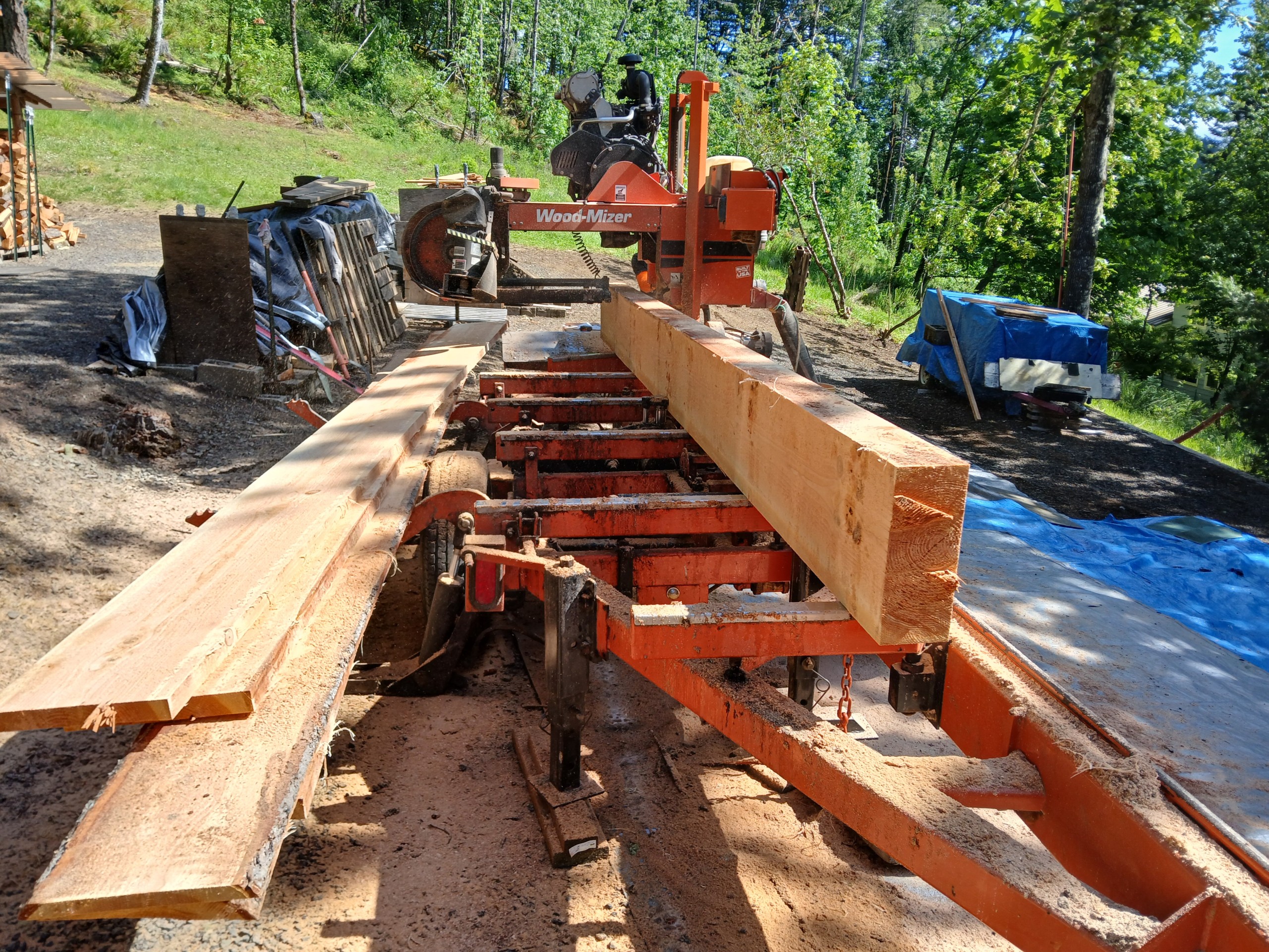 Wood-Mizer machine cutting a piece of lumber